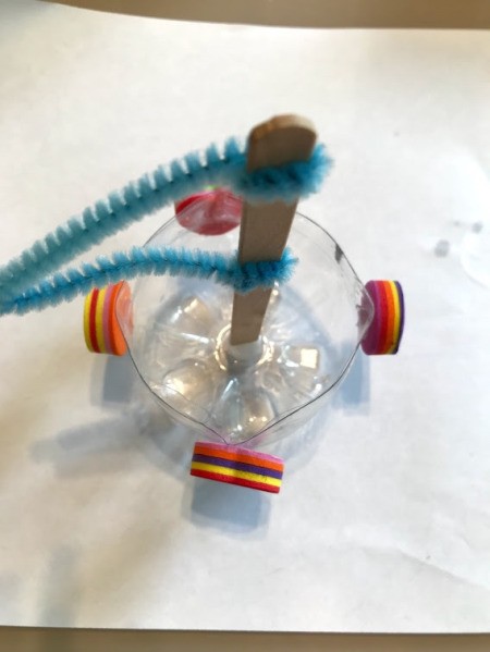 Recycled Plastic Bottle Boat - blue flag boat with foam shapes glued to sides