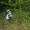 Weeding Pulling
Business Name Ideas - woman in field wearing a sun hat and carrying a plastic bag
