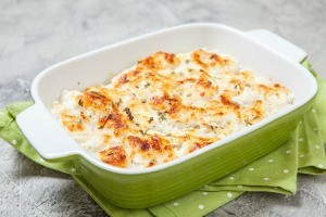 A casserole dish containing baked cod.