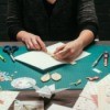 A woman making homemade greeting cards.