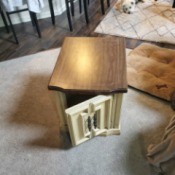 Value of a Mersman 89-62 Endtable - table with a woodtone top and cream base with door and storage
