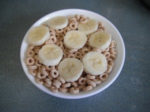 Use a Colander for Dust Free Final Serving of Cheerios - bowl of Cheerios with banana slices