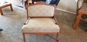 Identifying Antique Furniture - wide upholstered chair with wood trim and arms