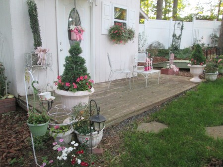 Use Spray Paint to Have a Choice in Planter Colors - newly painted and planted pots on deck