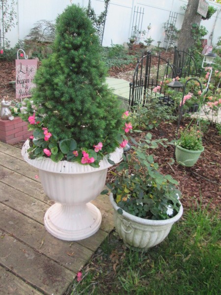 Use Spray Paint to Have a Choice in Planter Colors - flowers added to pots