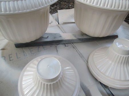 Use Spray Paint to Have a Choice in Planter Colors - painted pots drying on cardboard