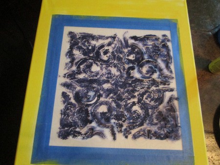 Easy Canvas Art - lightly tap blue paint into the stencil spaces