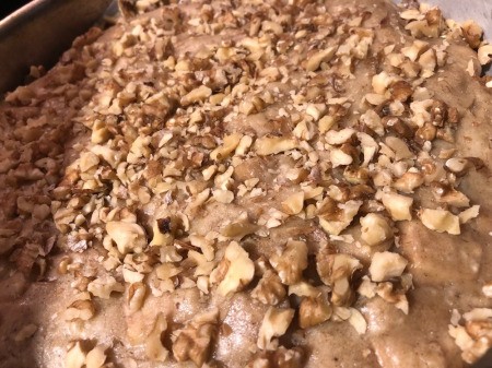 adding nuts to top of pan