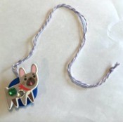 How to Make a Bottle Cap Necklace for Toddlers - finished necklace with a dog on the front