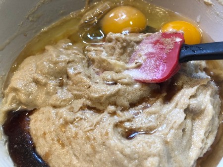 adding eggs to batter