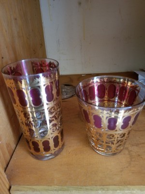 Value of Vintage Drinking Glasses - two different size glasses decorated with a gold filagree and purple pattern