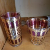 Value of Vintage Drinking Glasses - two different size glasses decorated with a gold filagree and purple pattern
