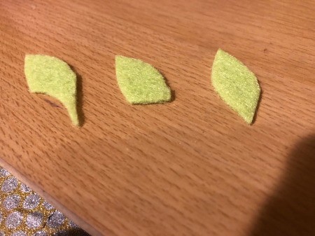 Easy Felt Flowers - cut little leaf shapes from green felt and glue to the underside of the rose