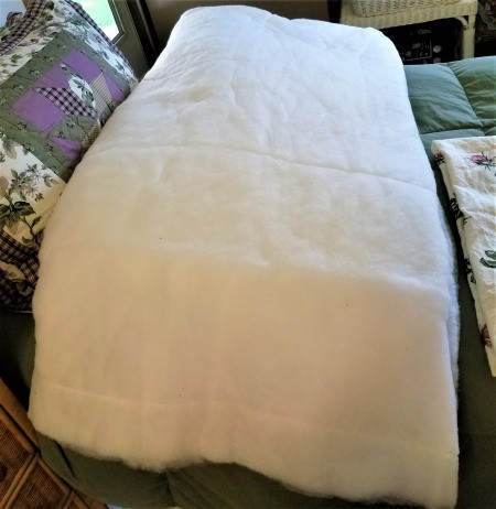 A king sized comforter that has been deconstructed and saved for reuse.