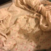 Restoring a Worn Out Blanket - very worn white blanket with small pink flowers