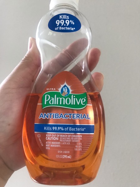 A bottle of Palmolive dish soap.