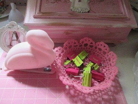 How to Make a Stiffened Doily Bowl - pink doily bowl filled with binder clips