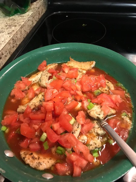 Salsa and chopped veggies added to pan