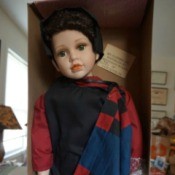 Information on a J Misa Porcelain Doll - doll in the box wearing "plain" clothes in solid colors