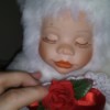 Value of Classical Treasures Porcelain Dolls - doll wearing a white fur suit with a red heart on the front