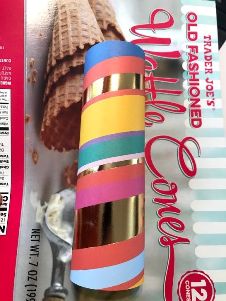 DIY Paper Towel Roll Kaleidoscope - wrapped roll laying on pasteboard box