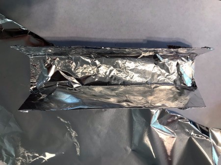 DIY Paper Towel Roll Kaleidoscope - fold into a triangle