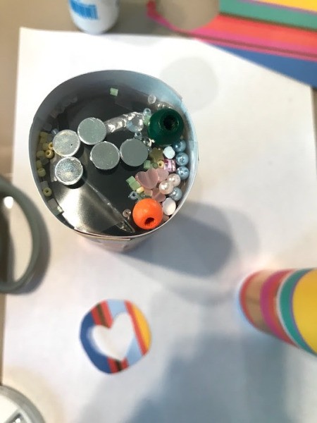DIY Paper Towel Roll Kaleidoscope - place the plastic circle over the triangle and add assorted beads