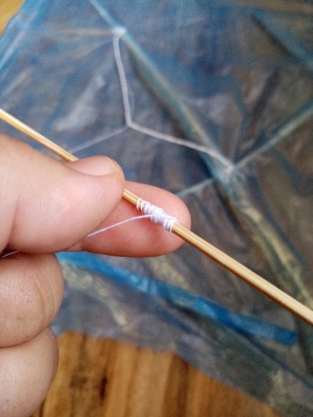 How to Make a Mini Kiddie Kite - tie the other end onto a stick