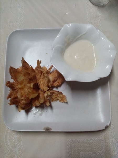 Blooming Onion and sauce on plate