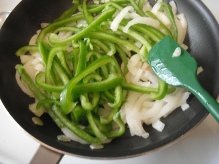 Stir Fried Onion and Green Pepper in pan in pan