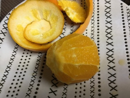 cutting peel from orange