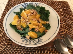 Baby Kale Walnut Orange Salad on plate