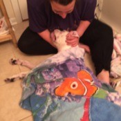 Reason for Dog's Sudden Death - woman holding dog's head