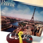 Photo Holder Rock - rock holding a photo of Paris, perhaps a postcard