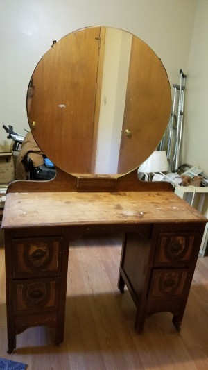 Finding the Value of a Vintage Dresser with Mirror - small dresser in need of refinishing with a large round mirror