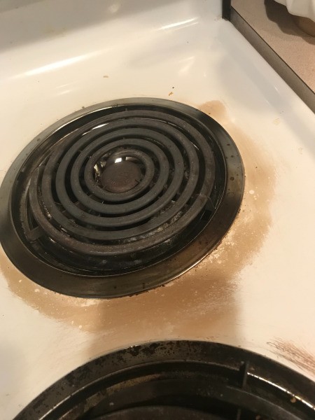 How to Clean a Burnt Enamel Top Stove - light brown stain around the element on an electric stove