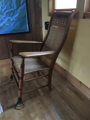 Identifying a Spring-foot Rocker - chair with springs on the front two legs, woven rattan back and seat