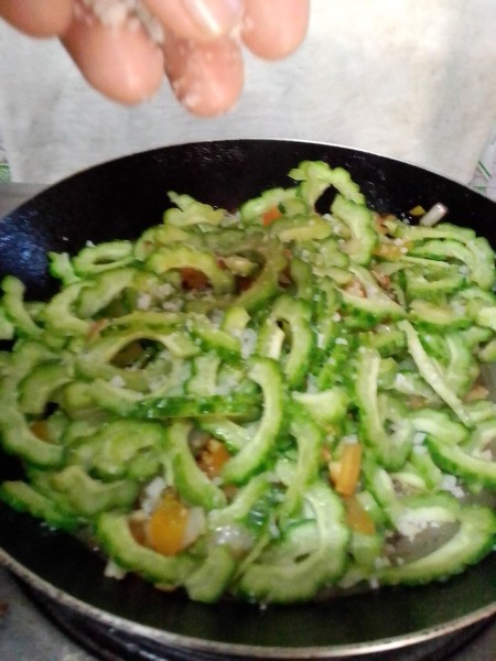 spreading salt in pan