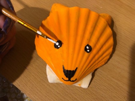 Make a Cute Fox from Shells - use white paint to add sparkle to the eyes