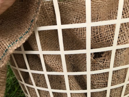 Making a Strawberry Planter from a Laundry Basket - cut holes in the burlap from the side