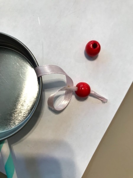 Kid Toy Rattle Drum - thread beads on the ribbon and knot in place