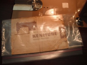 An old Kenmore sewing machine manual in a plastic bag.