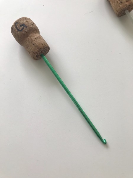 Champagne Cork Crochet Hook Savers - hook stuck in cork