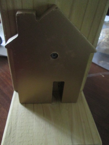 Making Super Easy Wooden Bookends - house screwed to upright piece of bookend prior to painting