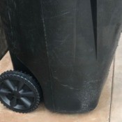A trash bin with newly repaired wheels.