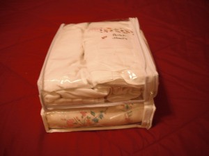 Linens stored in a clear zipper bag.