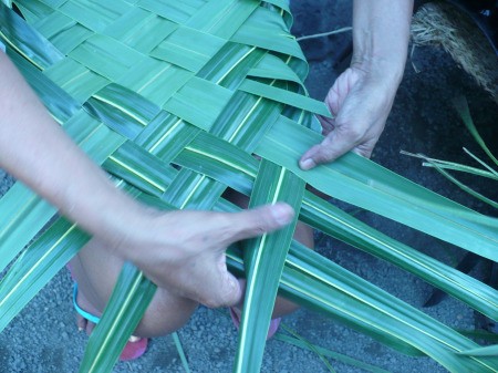 Weaving Coconut Leaf Plates - turning the leaves and weaving back to the other side