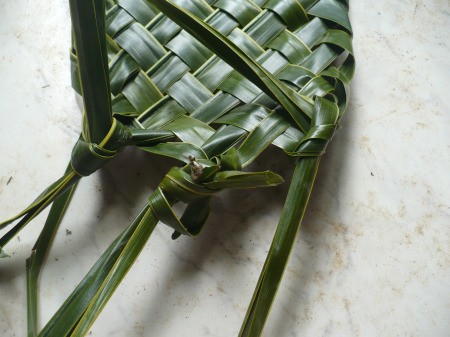 Weaving Coconut Leaf Plates - knot the leaves on the right and the left