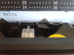 Repairing a Smith Corona SL575 Typewriter - closeup of  a page in the typewriter with a letter corrected