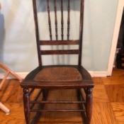 Value of an Antique Rocking Chair - high backed dark wooden rocking chair